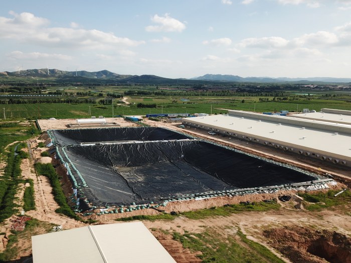 Oxidation pond liner installation at sewage treatment site
